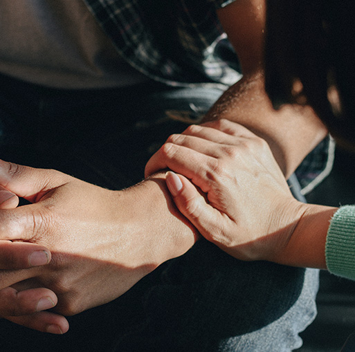 two men laughing on stairs one in wheelchair enjoying life together three moments of joy