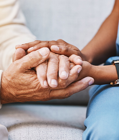 two hands holding each other symbolizing connection and support showcasing tenderness and caring for six important moments