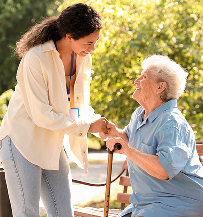 student studying while taking notes in a library with two peers discussing nearby enhancing study habits for six subjects